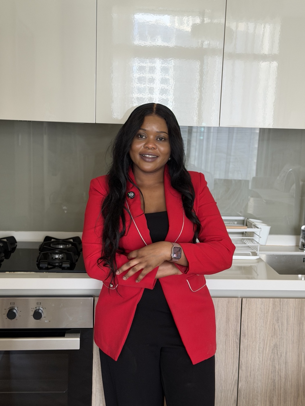 A member of the UNIT55 team in an apartment kitchen